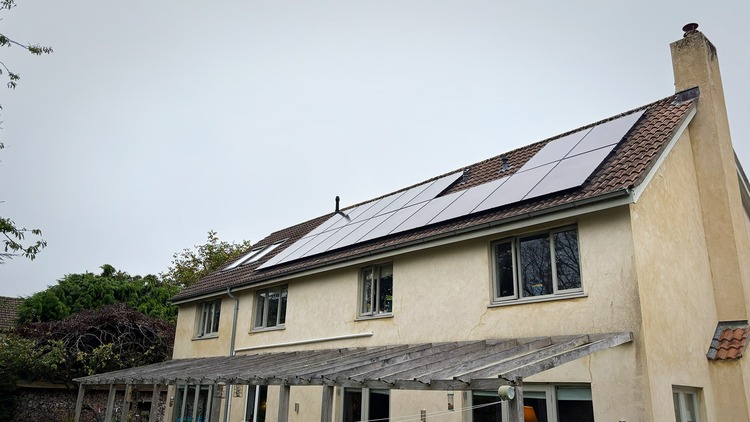 Large home with solar panels on roof